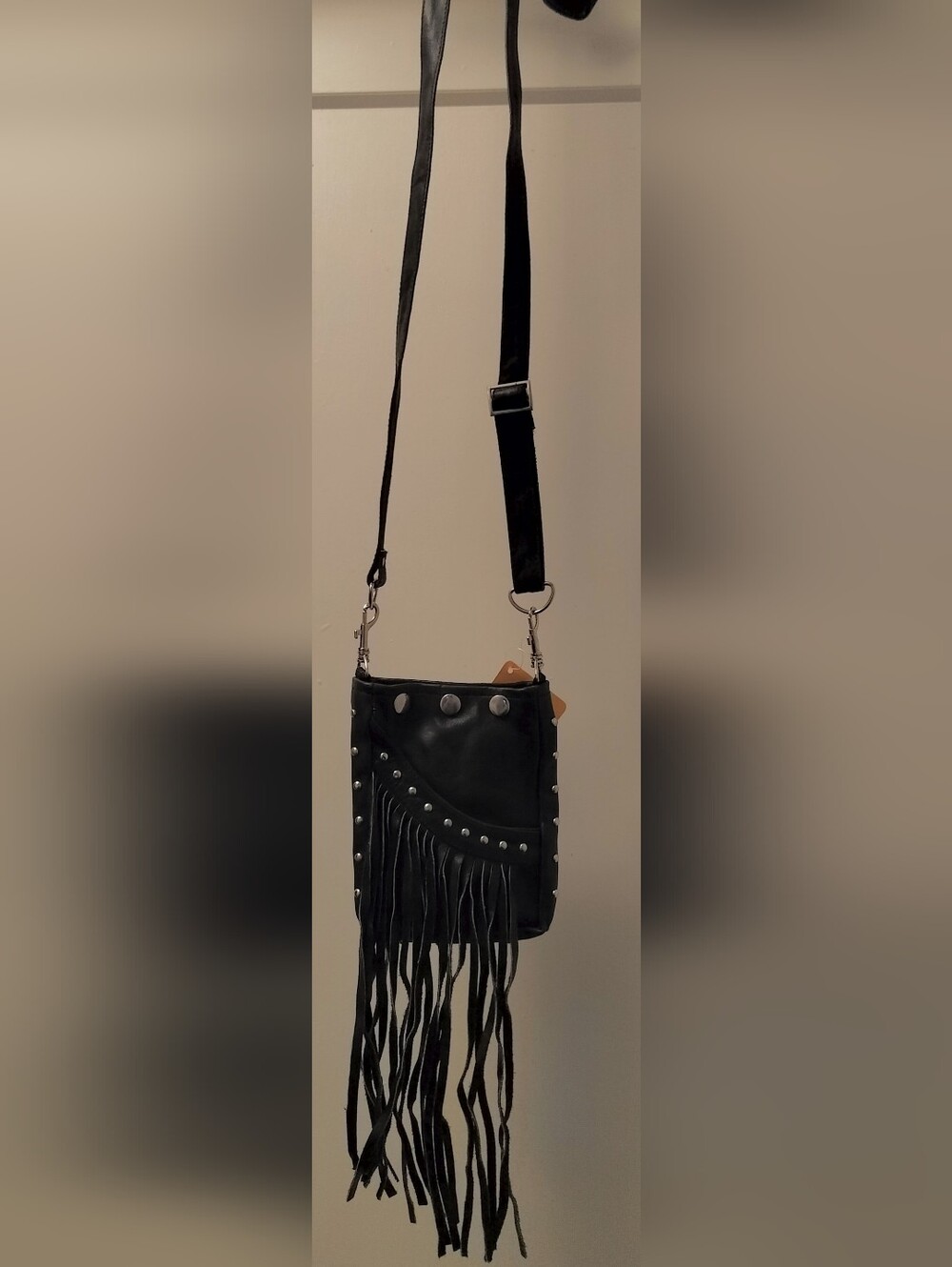 Black Leather Crossbody Bag With Fringe And Silver Studs On Outside Pocket